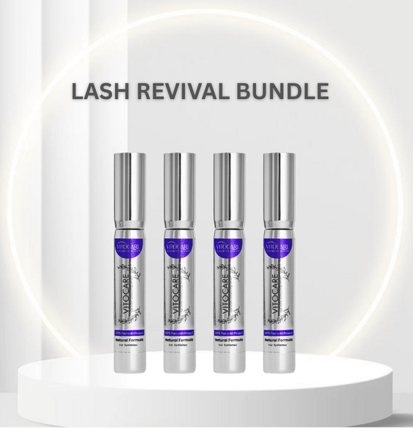 Four silver bottles with purple labels on a white platform, labeled 'Lash Revival Bundle'.