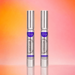 Two VITOCARE skincare products on a gradient background