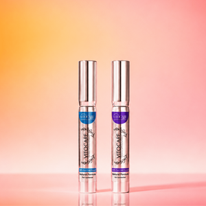 Two silver bottles with purple labels on a gradient pink and orange background