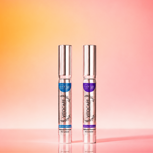 Two silver bottles with purple labels on a gradient pink and orange background