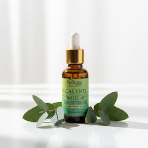 Bottle of eucalyptus oil with dropper on a gray background