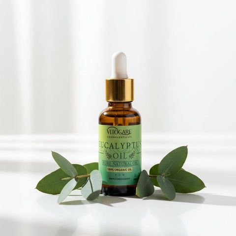Bottle of eucalyptus oil with dropper on a gray background