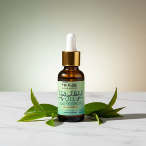 Vitacare Tea Tree Oil bottle with dropper on a white background