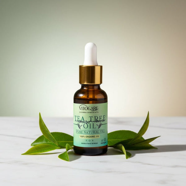 Vitacare Tea Tree Oil bottle with dropper on a white background